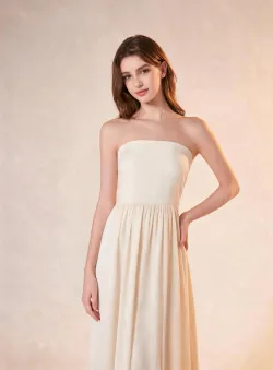 Change out of all clothes and put on a light-colored long strapless dress