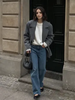 Female, adult, medium skin tone, oval face shape, symmetrical facial features, shoulder-length wavy brown hair, slim yet curvaceous body type, natural and polished model look.